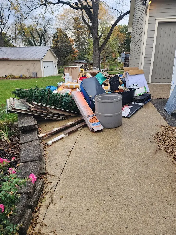 Dumpster being loaded with debris for Residential Dumpster Rental in Slidell